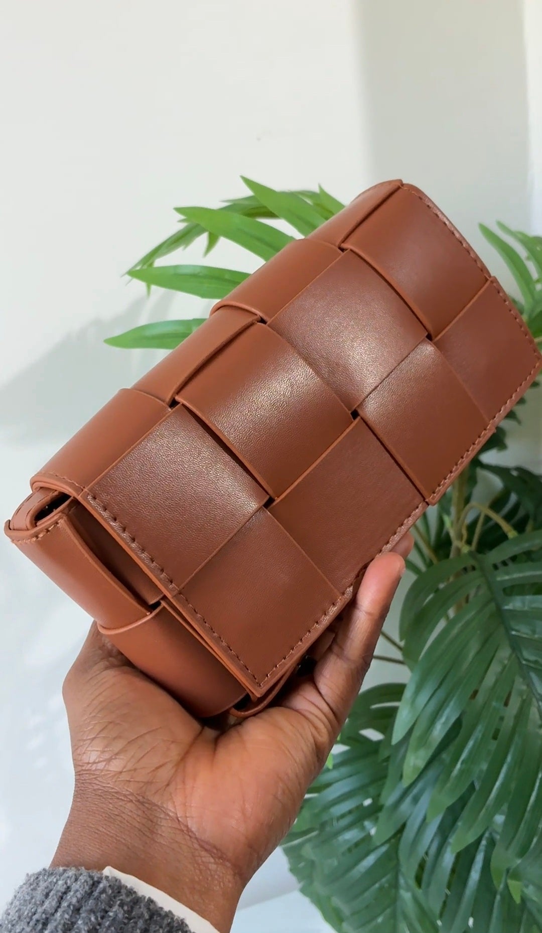 Woven leather bag with buckle detail
