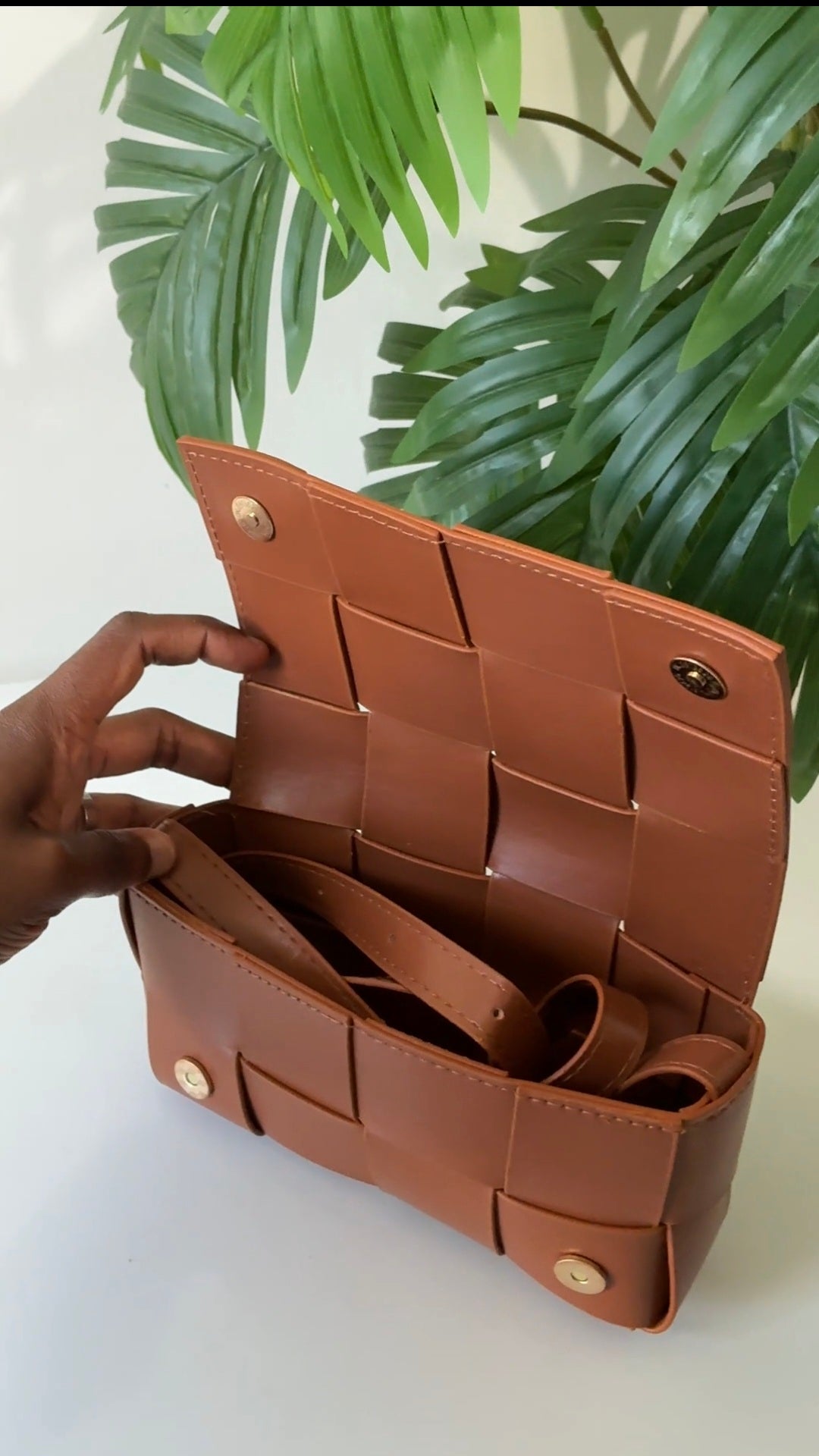 Woven leather bag with buckle detail