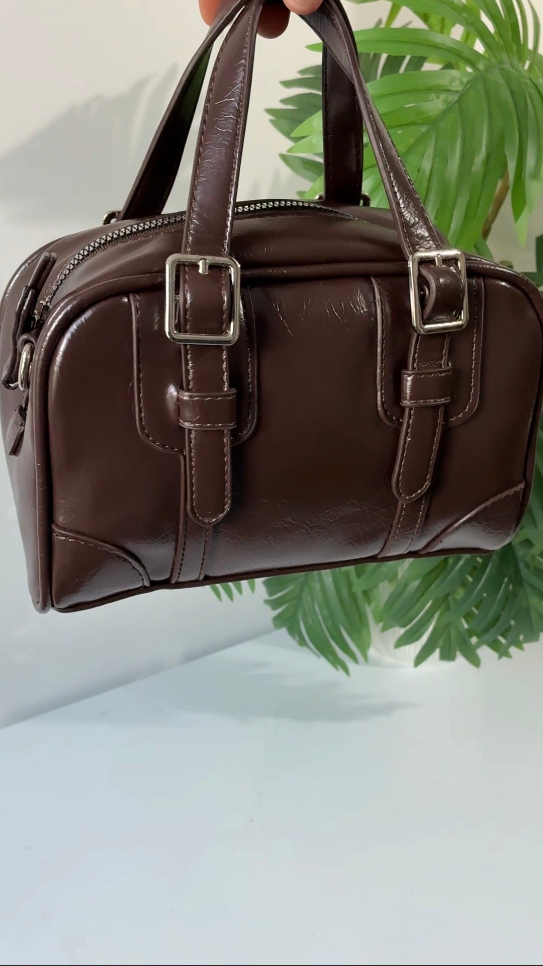 Buckle strap detail brown bag