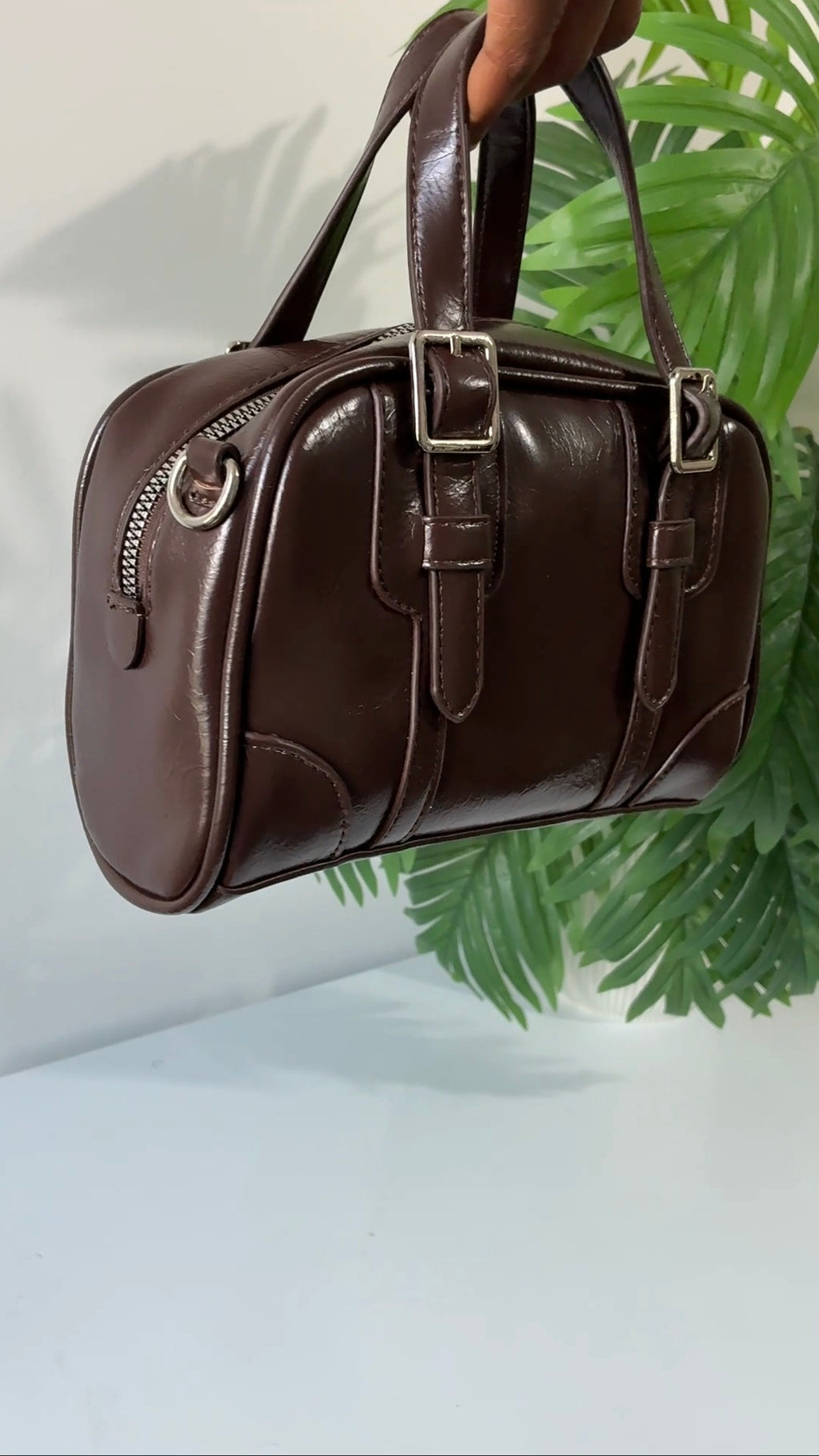 Buckle strap detail brown bag