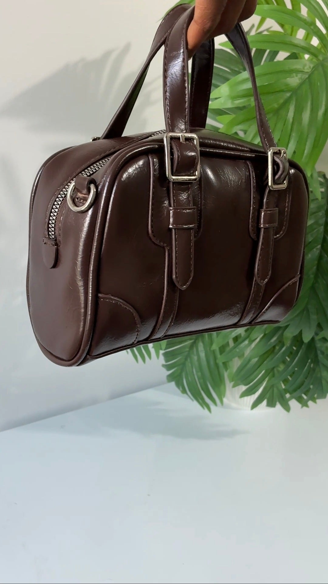 Buckle strap detail brown bag