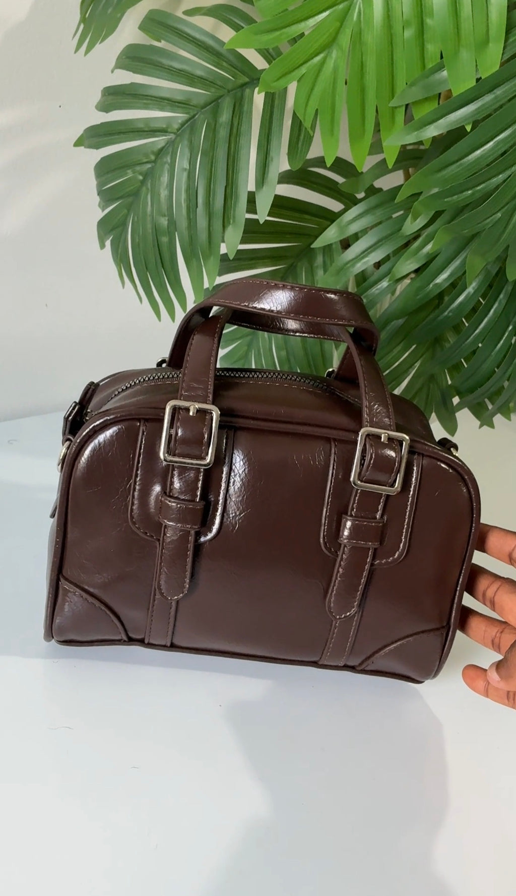 Buckle strap detail brown bag